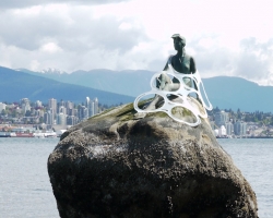 Plastic Pollution Coalition: Plastic is Forever - Girl in Wetsuit caught in stunt